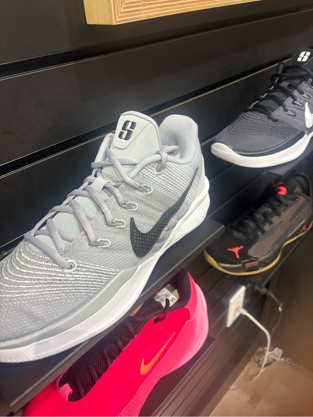 Nike Women’s Light Gray Athletic Shoes with Black Swoosh